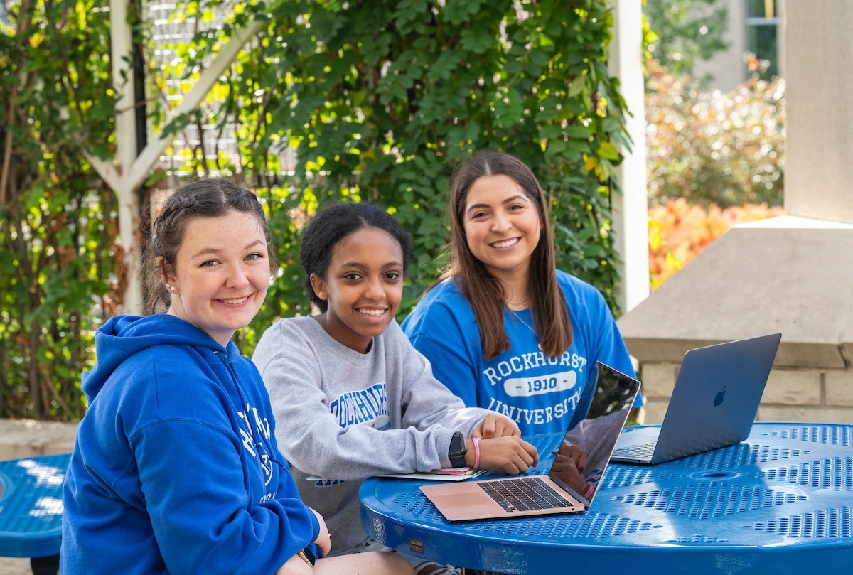 Students studying by pergola