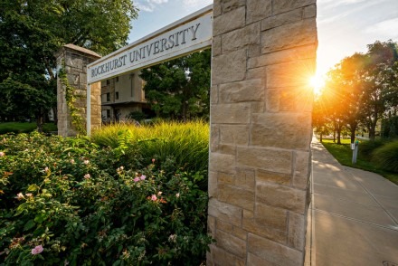 Welcome gate with sunrise behind the pillars